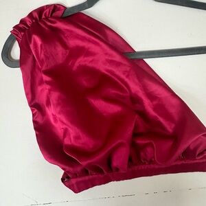 Off-the shoulder fuchsia satin crop top with slits on the side